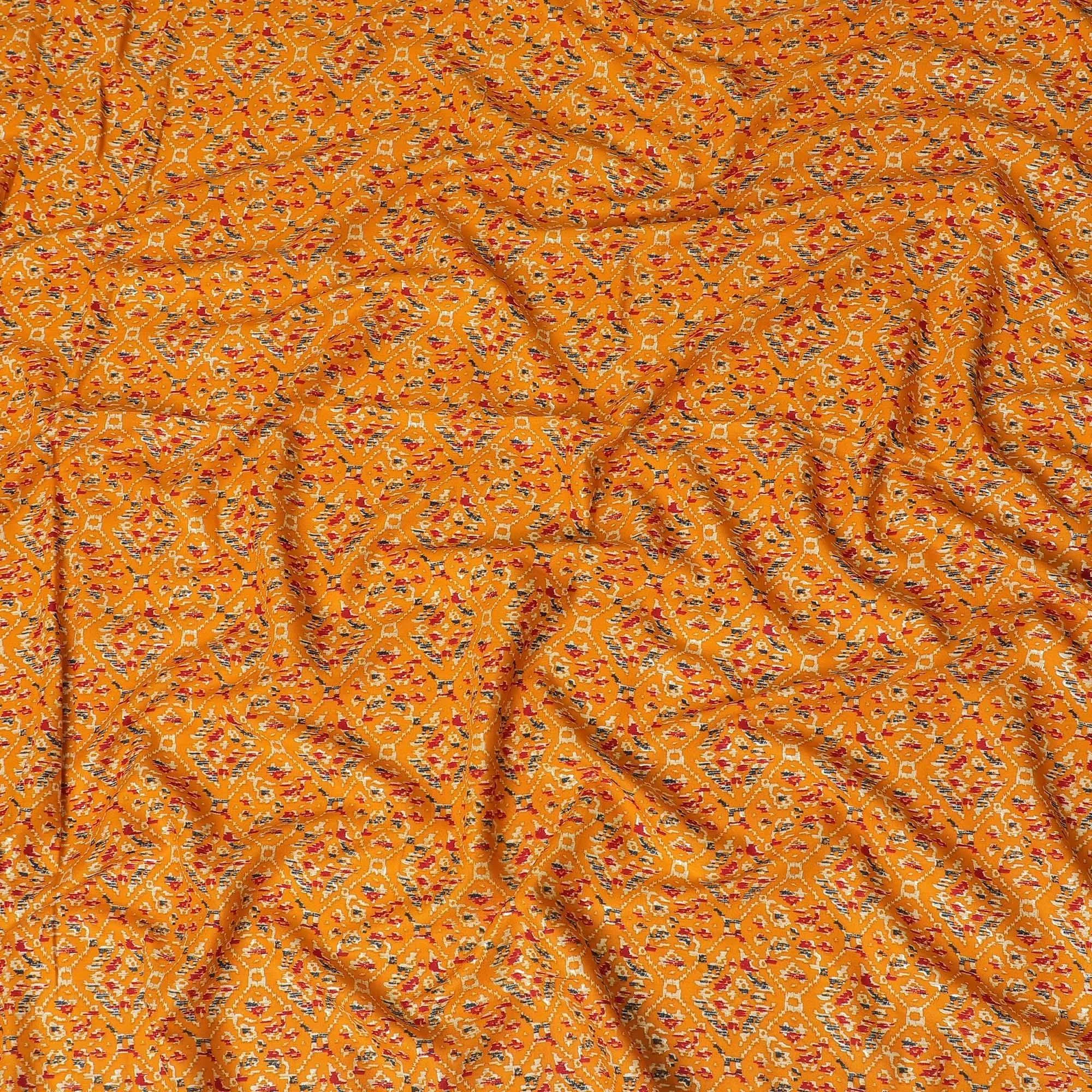 Mustard orange cotton viscose fabric with black, orange and gold print in batik design-D14195
