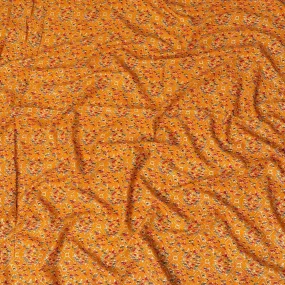 Mustard orange cotton viscose fabric with black, orange and gold print in batik design-D14195
